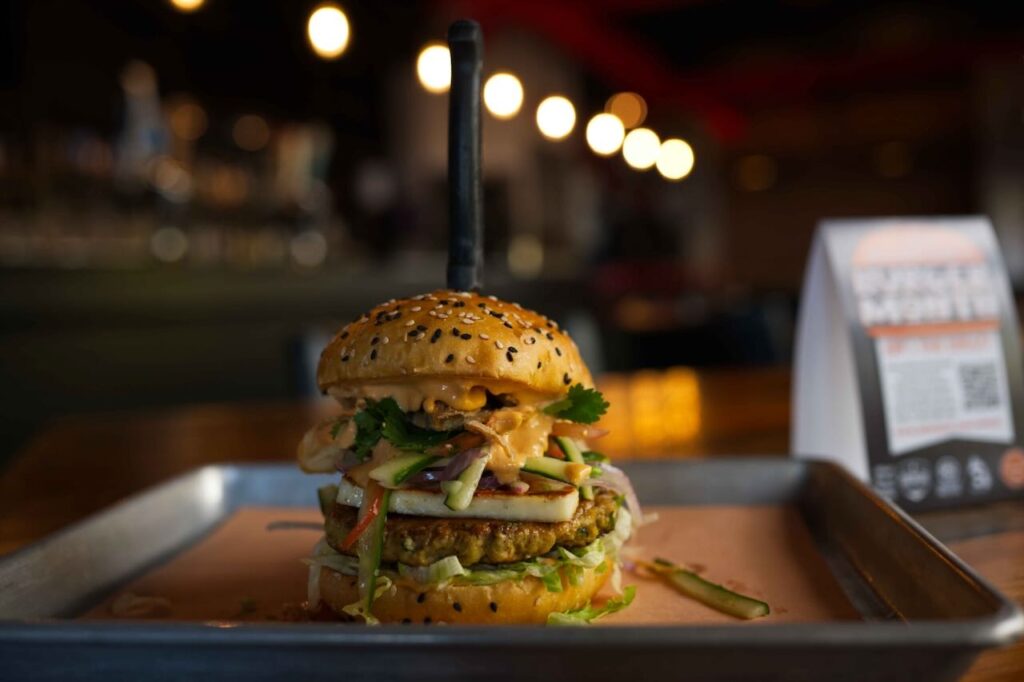 Brixx Brewhouse with a chicken burger, cucumbers, paneer, and fresh veggies