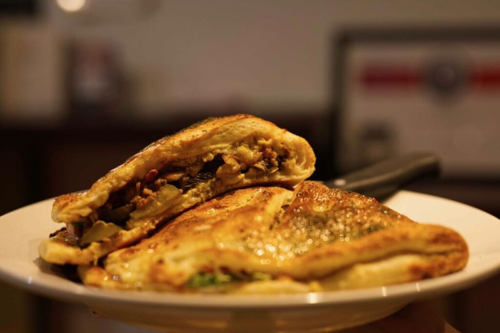 Tonik Distillery's burger in a calzone